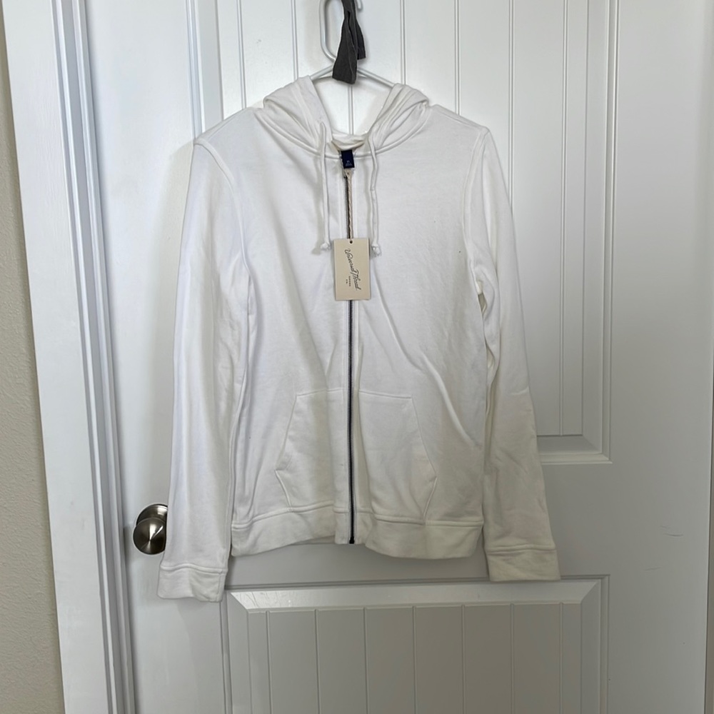 XS (runs big) universal threads white zip up, new with tags.